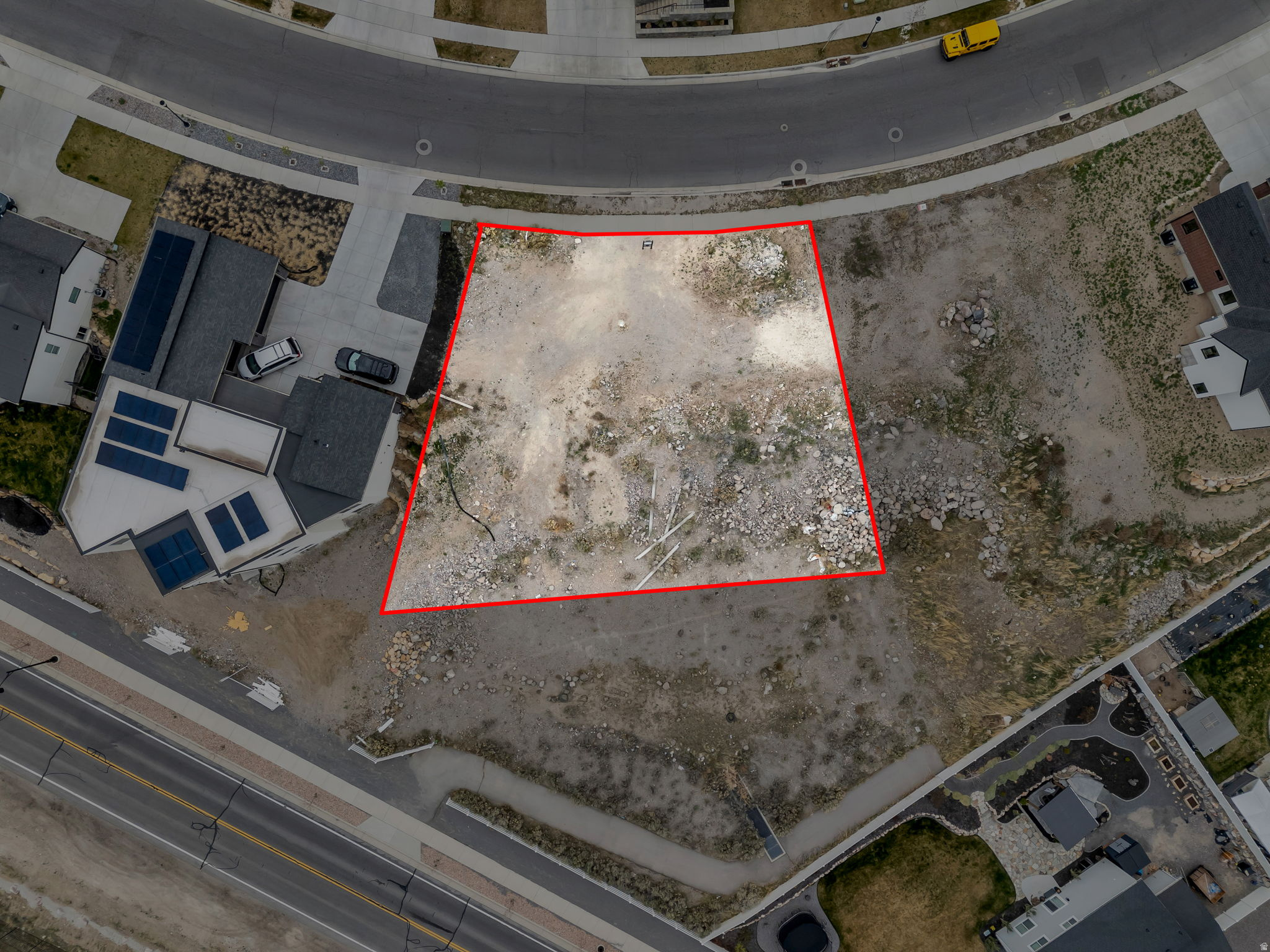 Aerial view of lot and mountain context