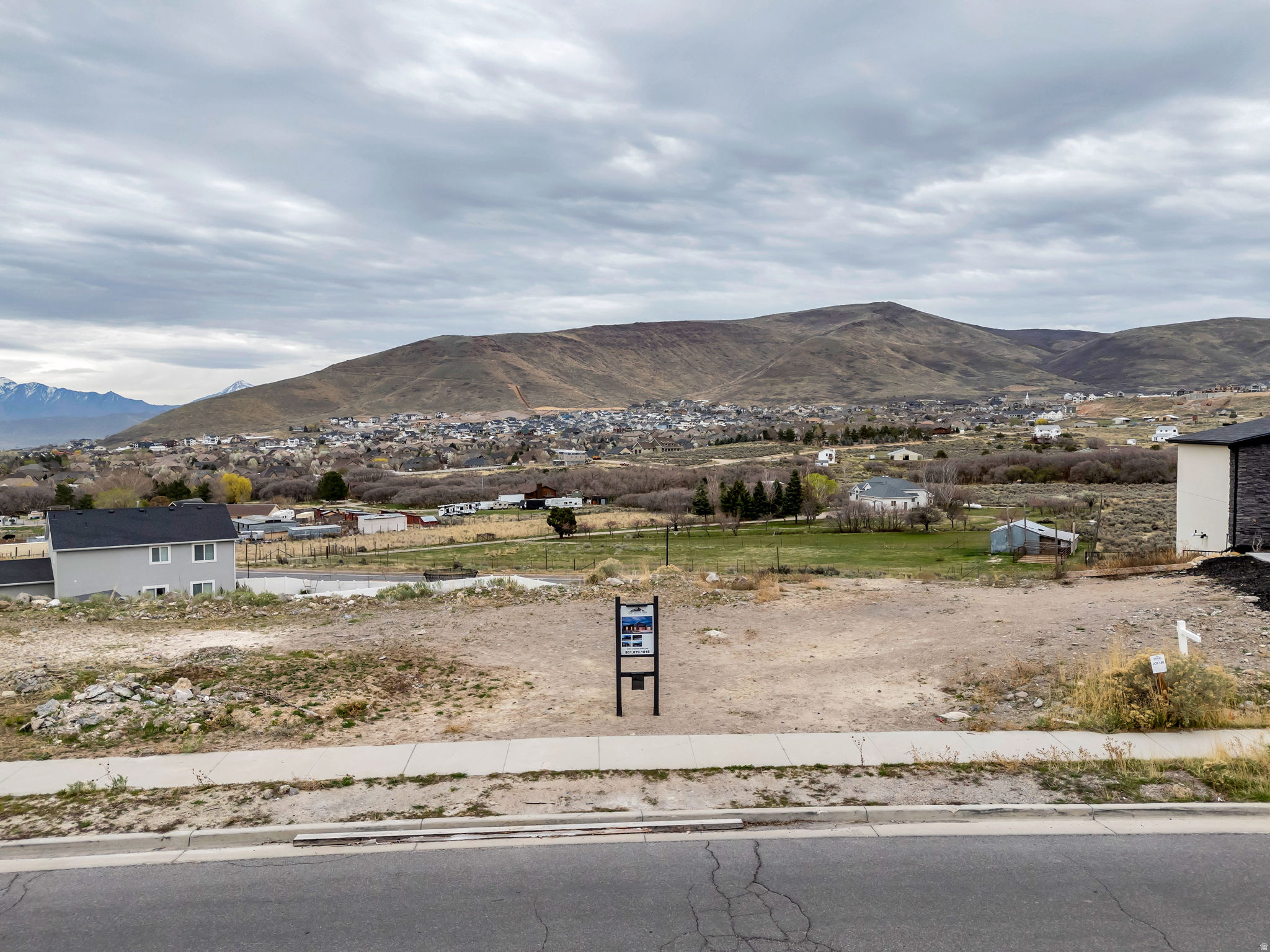 Street-level view of the lot with valley backdrop